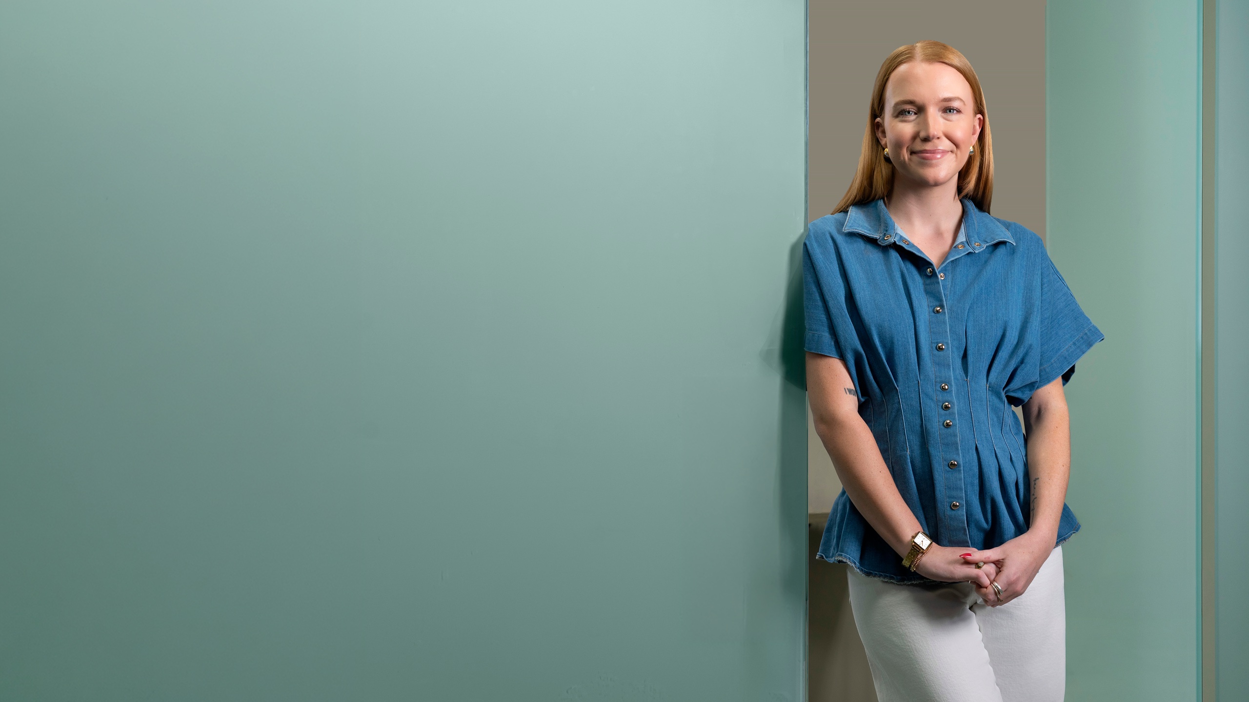Smiling professional in a blue shirt